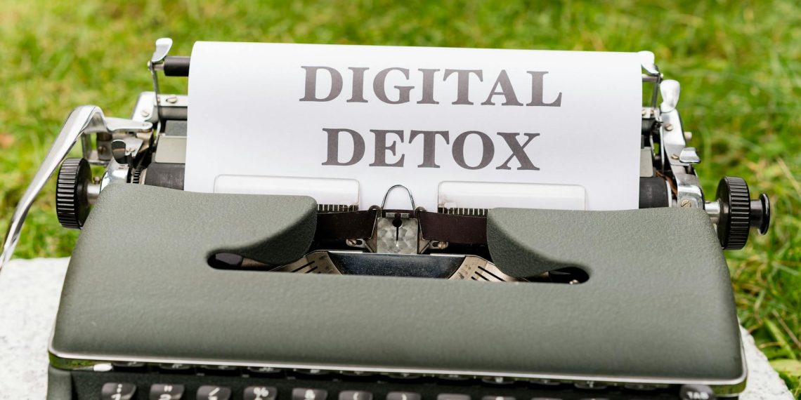 a typewriter with the words digital detox written on it