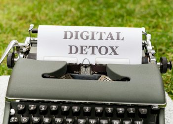 a typewriter with the words digital detox written on it