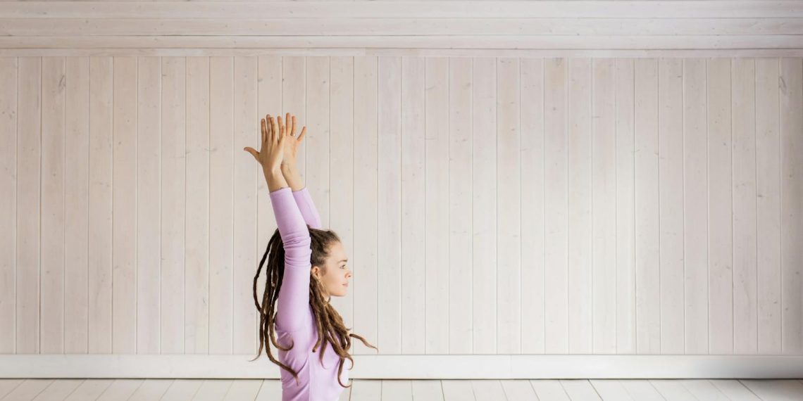 photo of woman putting her hands up