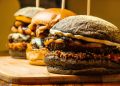 burgers on brown wooden chopping board